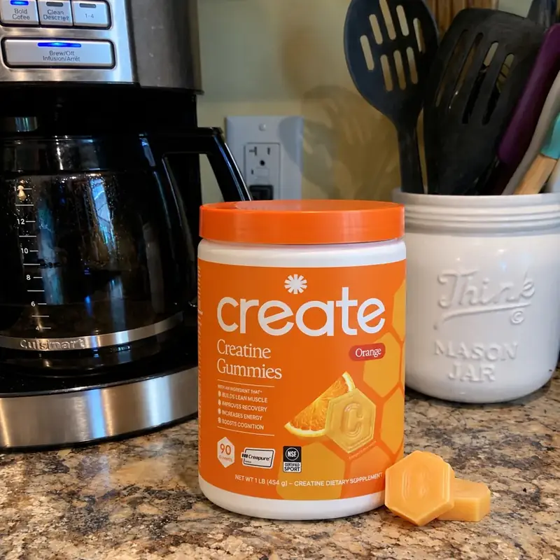 Orange creatine gummies photographed on the Vitamin Hippo kitchen counter